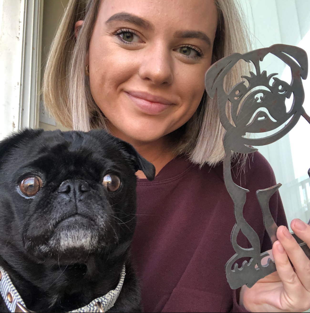 Customer with a pug and matching steel silhouette