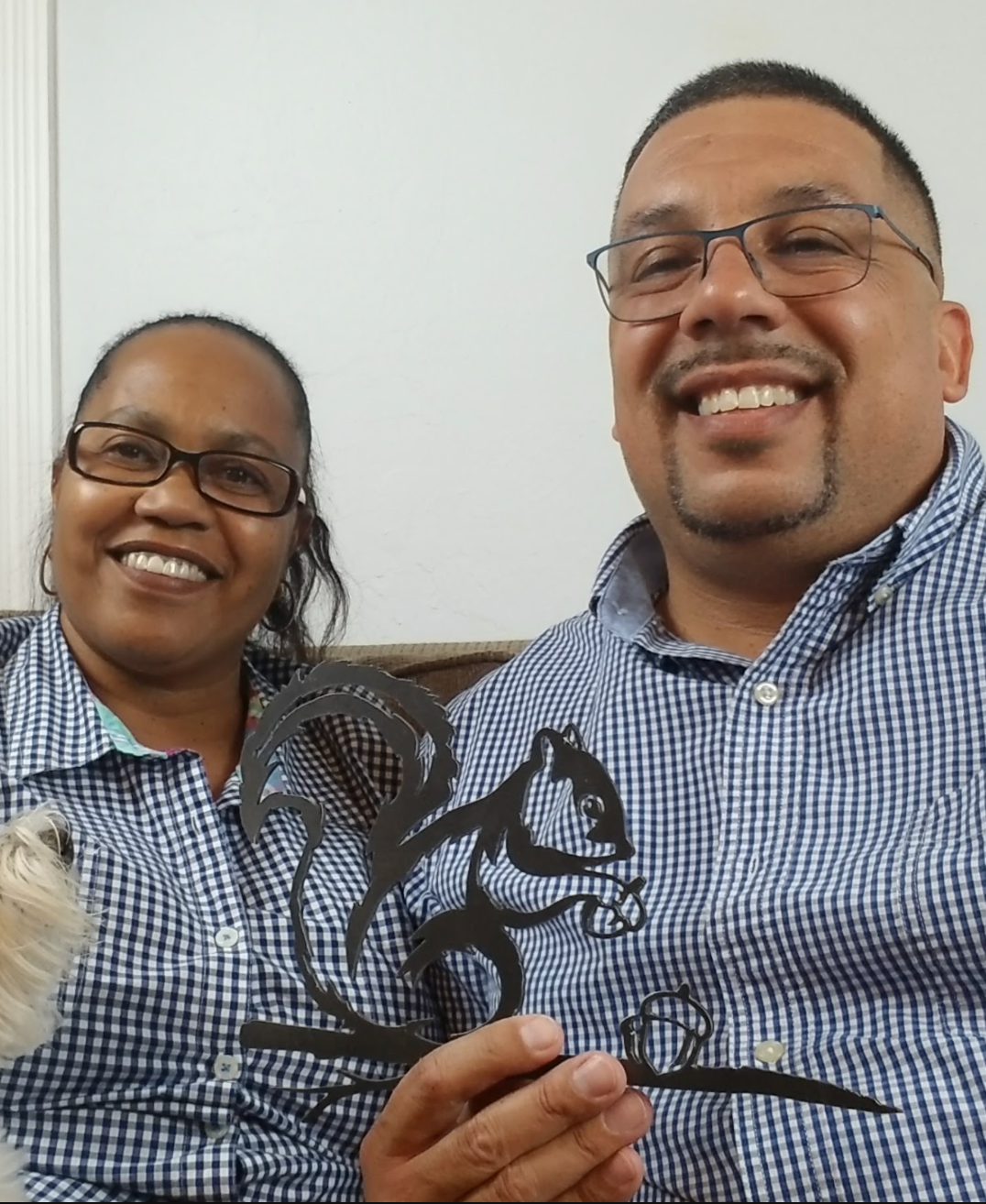 Customers holding a squirrel steel silhouette