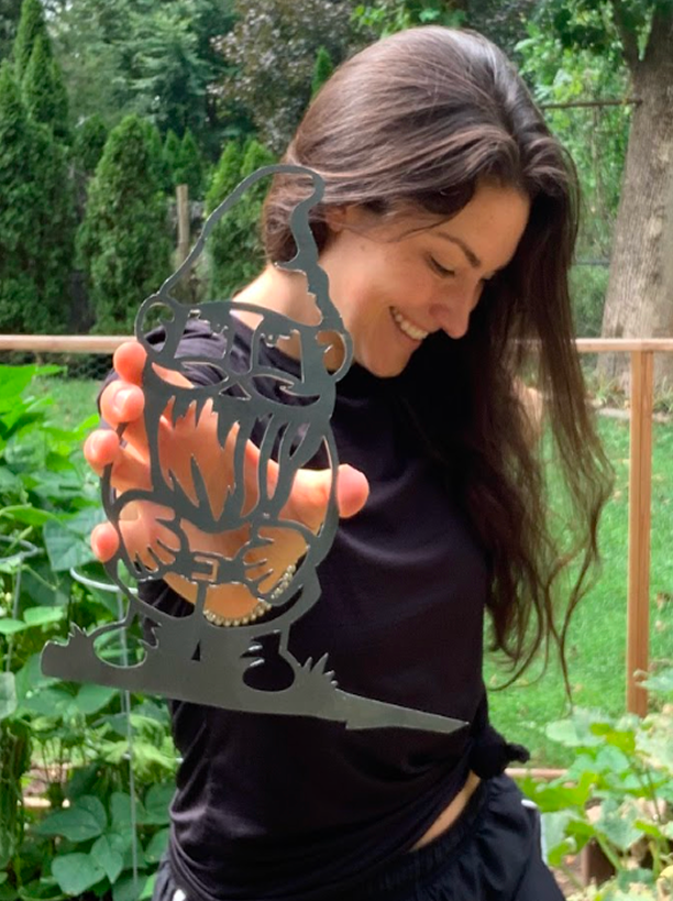 Customer holding steel outdoor decor